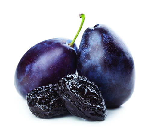 Two plums with two prunes in front of them.