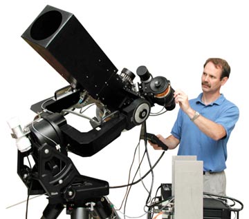 An image of a man with the STARE telescope.