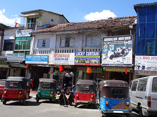 The image shows a section of a typical city centre street in Kandy, Sri Lanka.