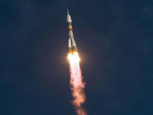 An image of a colour photograph of the Expedition 33 Soyuz rocket launch.