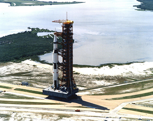 An image of a colour photograph of the Saturn V rocket at the Kennedy Space Centre.