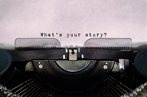 An old-fashioned typewriter has been used to type ‘What’s your story?’ on to a piece of paper.