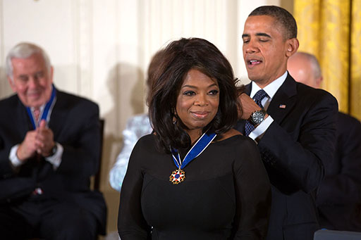 Oprah Winfrey receiving the Presidential Medal of Freedom from President Barack Obama