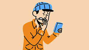 Man looking at phone, hand in mouth