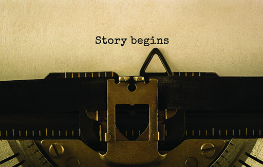 A typewriter with the words ‘Story begins’ written on a sheet of paper.