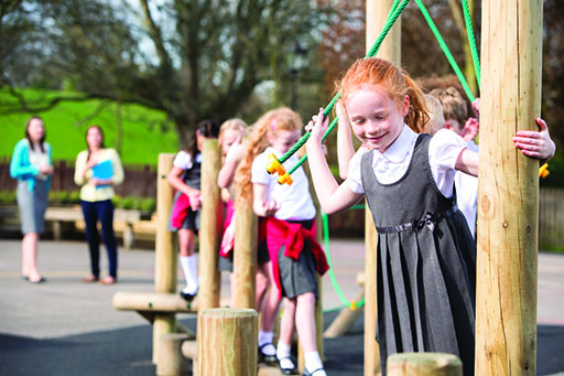A photograph of children in a playground.