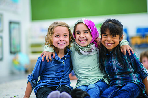 A photograph of three young girls.