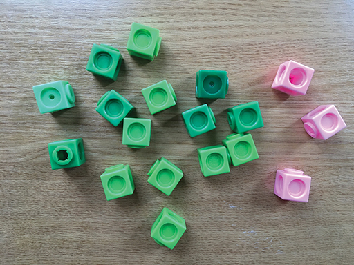 More cubes: fifteen green and three pink