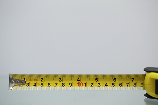 A tape measure showing inches and centimetres