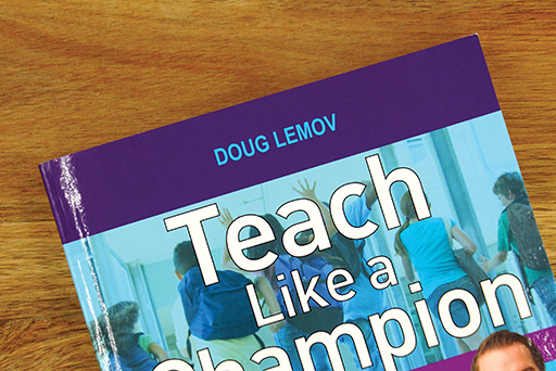 A closeup of a book on a table – ‘Teach like a champion’ by Doug Lemov.
