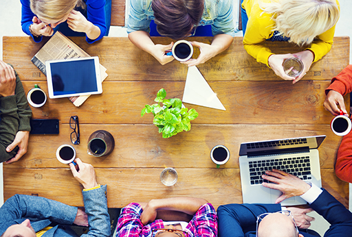 People sitting at a table in a cafe