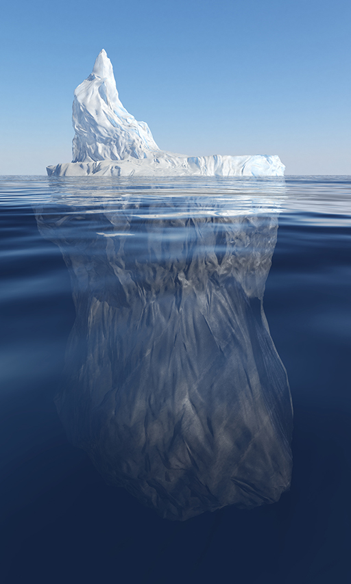 An iceberg showing above and below water