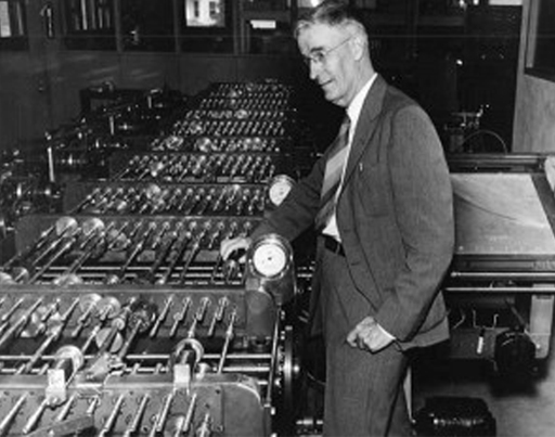Vannevar Bush with an electromechanical device for helping solve complex differential equations