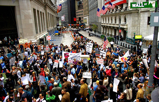 A photograph of protestors on Wall Street, New York during the 2007/2008 financial crisis.