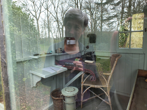 Reflection in a window of a woman.