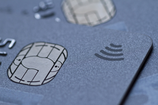Image is a close up of a debit or credit card, focusing on the embedded chip.