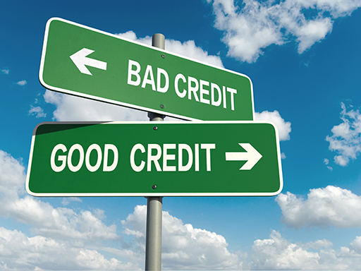 The image is of two road signs on the same support pole. One sign says ‘Good Credit’, the other ‘Bad Credit’