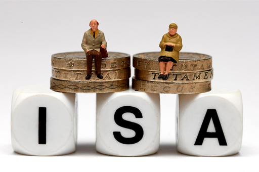 The image has three dice at the bottom with the letters ‘ISA’ spelt on them. Sitting on top of the dice are two piles each of three £1 coins. Sitting on top of one of the two piles of coins is a small model of an elderly man and on top of the other pile is a small model of an elderly woman.