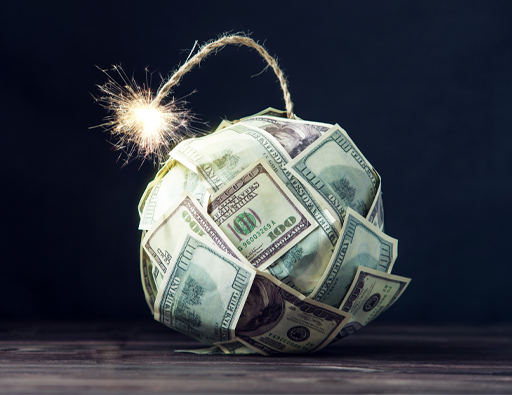 This shows a group of $100 bills forming a ball, which is being set on fire.