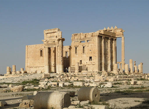 The Temple of Baalshamin in Syria before it was destroyed. The temple pictured here shows the dominant columns stretching from the ground upwards, and the main central structure.