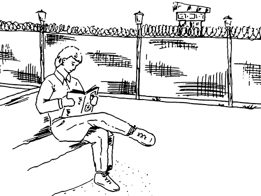 This is an illustration of a man in a prison compound, sitting on a bench reading a book.