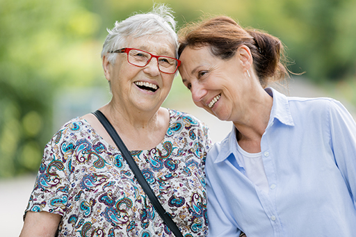 This is a photograph of two women smiling.