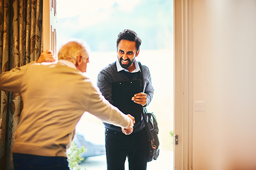 This is a photograph of two men shaking hands.