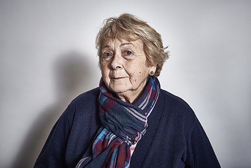 This is a photograph of a woman wearing a scarf.