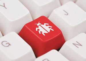 Image of a red key on a keyboard of white keys. Red key has image of a bug on it.