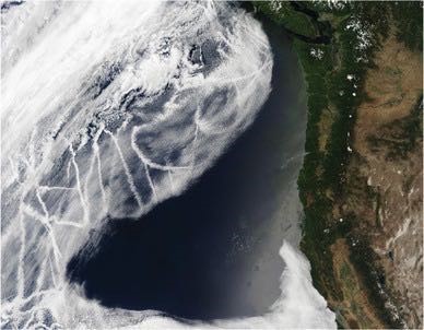 Figure 8 is a satellite photograph showing tracks of ships as bright lines criss-crossing cloud. The scene is close to the coast.