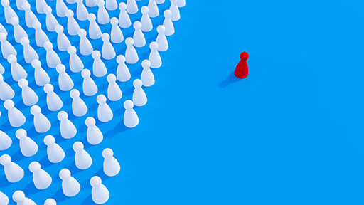 This is a graphic showing a group of white figures on the left and one single red figure on the right.