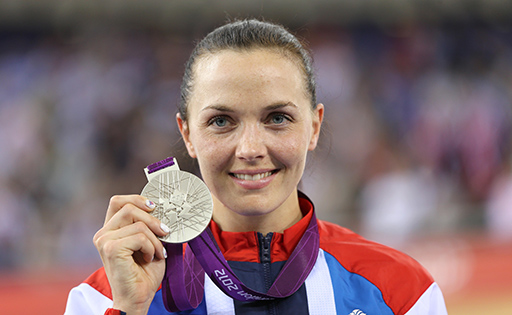 Victoria Pendleton holding up her silver medal at the London 2012 Olympics.