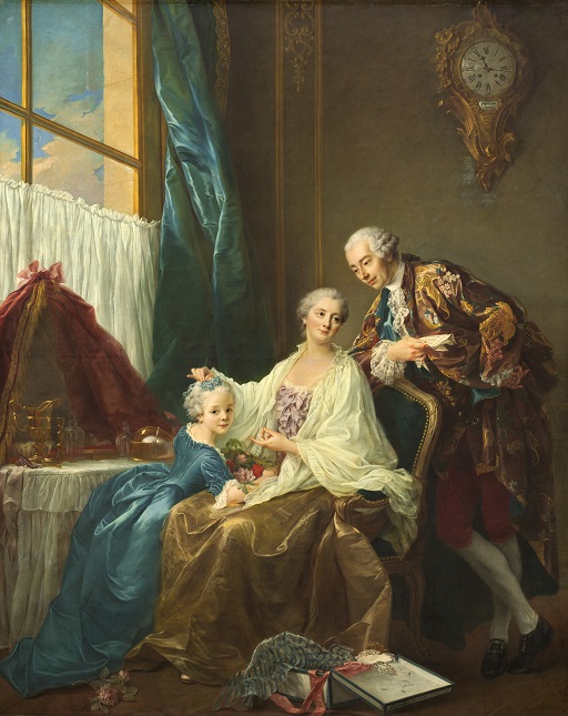 The picture shows a father, mother and child relaxing together in a opulent looking room.