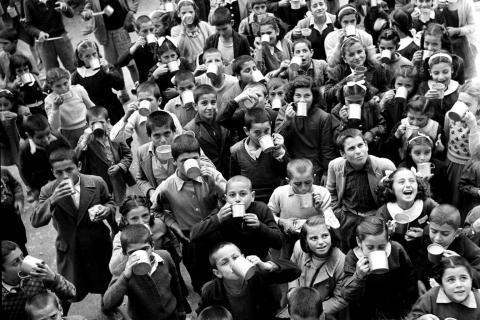 This is a black-and-white photograph of a group of children.