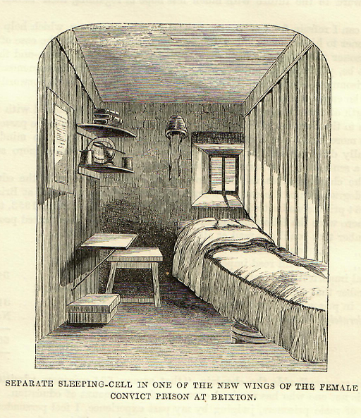 This is a black and white drawing of a prison cell, containing a narrow bed, a stool, and a drop-down table fastened to the wood-panelled side wall. There is a small window above the head of the bed on the right. On two corner shelves at upper left are a plate, two mugs, and a pile of three books.