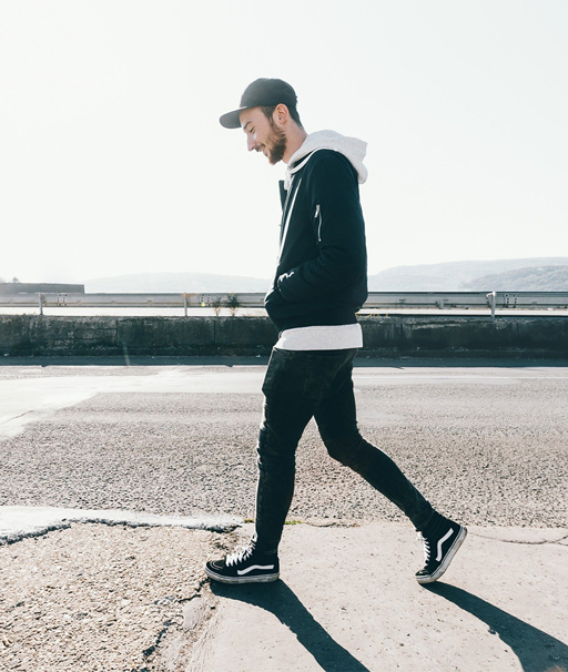 Side on view of a person walking.