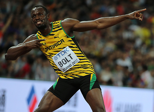 Usain Bolt striking the lightning pose after a race.