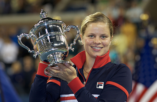 Kim Clijsters holding up a trophy.