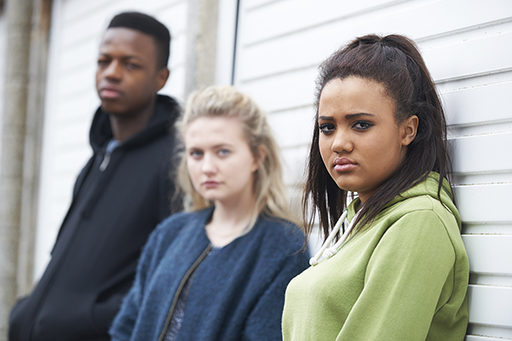This is a photograph of two girls and a boy.
