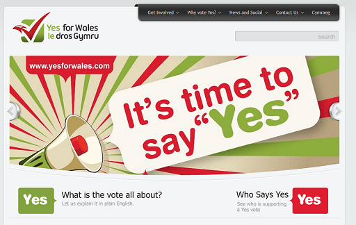 This is a screenshot from a website set up by Yes for Wales. The banner image shows a cartoon megaphone with a speech bubble: 'It's time to say "Yes"'. Underneath the banner there are buttons linking to other sections of the website, labelled with the text: 'What is the vote all about? Let us explain it in plain English' and 'Who Says Yes? See who is supporting a Yes vote'.