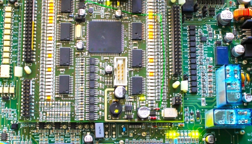A processor assembled on a motherboard along with other circuit components.