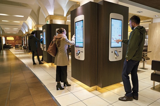 A self service ticket machine in a public area.
