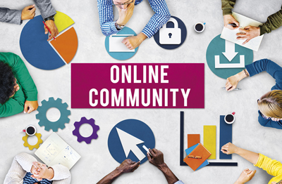 Seven people sitting around the outer edge of the photo with only their arms showing. In the middle are the words ‘Online community’.