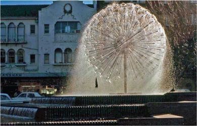 This photograph shows the El Alamein Fountain, which has a number of water fountains pointing outwards from one point in all directions, so it is effectively a sphere of nozzles spraying water in all directions.