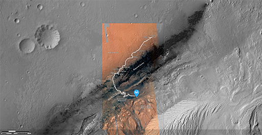 This figure is a screenshot of the NASA interactive map, showing a satellite, greyscale image of the martian surface near a crater edge. The traverse of the Curiosity rover is overlaid as a white line, moving from inside the crater to the rim.