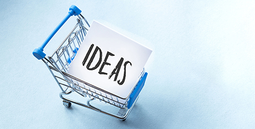 Mini shopping trolley filled with a piee of card which reads ‘Ideas’.