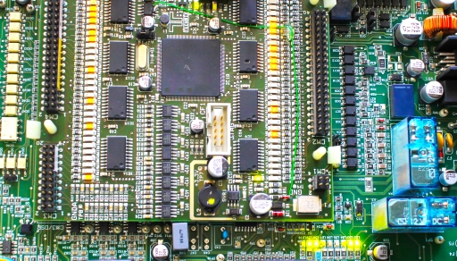 A processor assembled on a motherboard along with other circuit components.