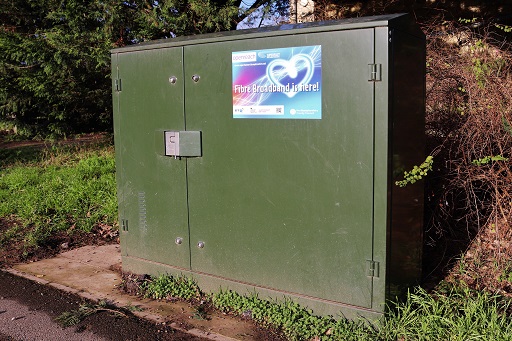 This is a photograph of a local cabinet on a residential street.