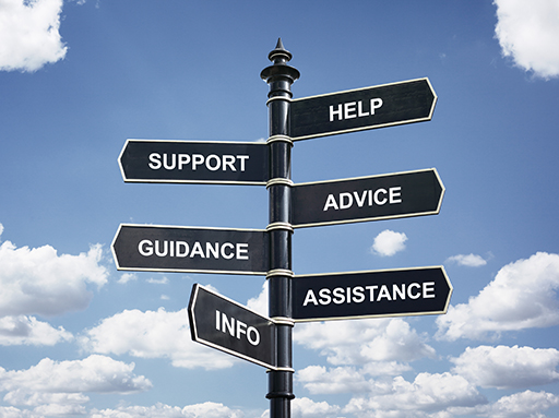 A sign with directions to: Help, Support, Advice, Guidance, Assistance and Info.
