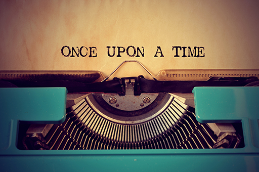 A typewriter with the text ‘Once upon a time’ printed on paper.
